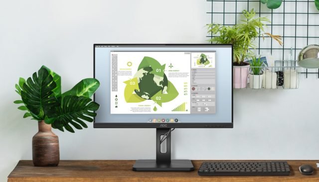 una scrivania con un monitor aoc