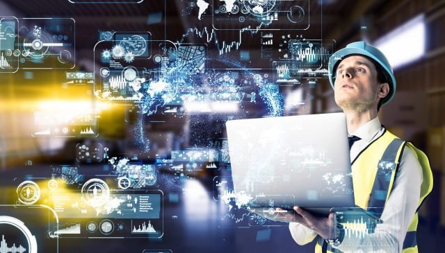 un tecnico al lavoro su una macchina industriale