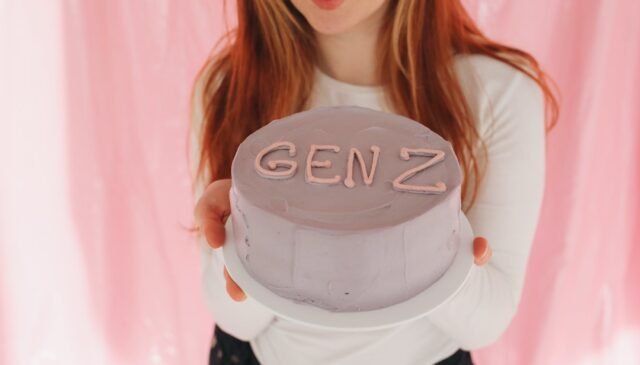 person holding a minimalist cake