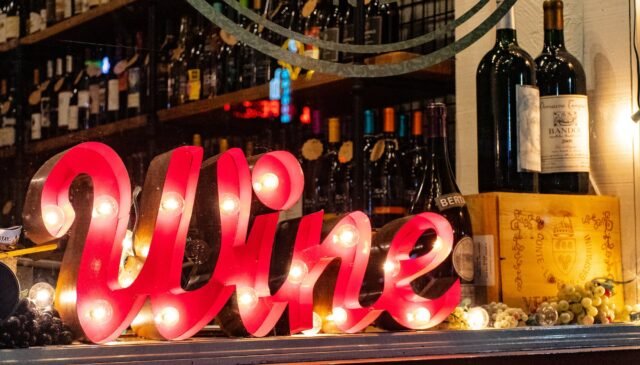 red wine marquee signage on table