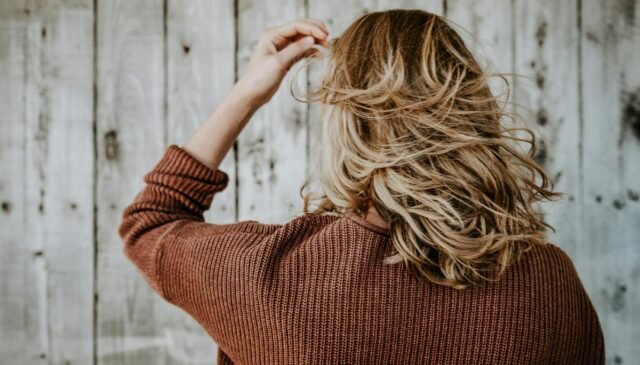 selective focus photography of woman with blonde hair