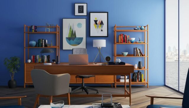 brown wooden desk with rolling chair and shelves near window