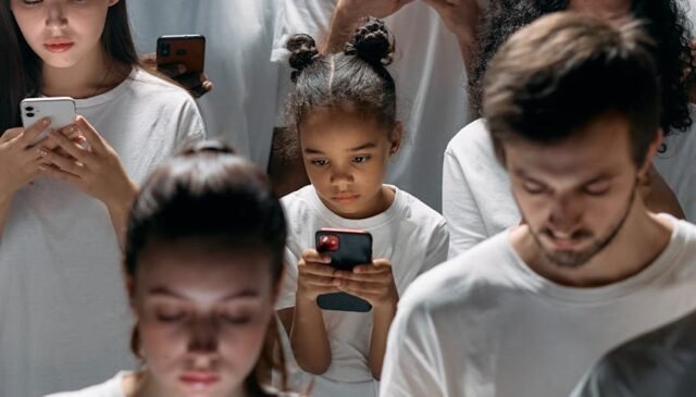 photo of people engaged on their phones