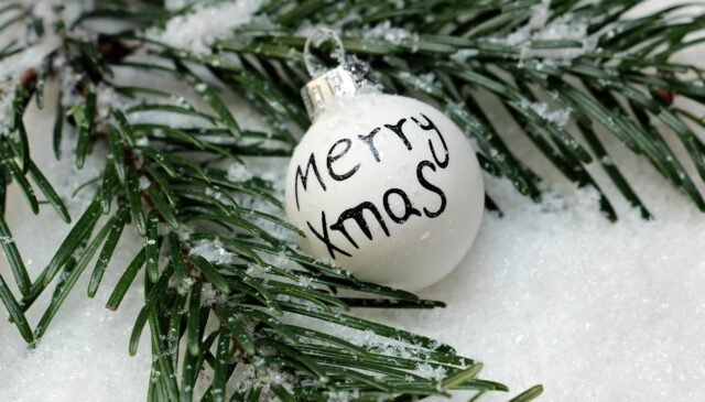 white bauble on christmas tree