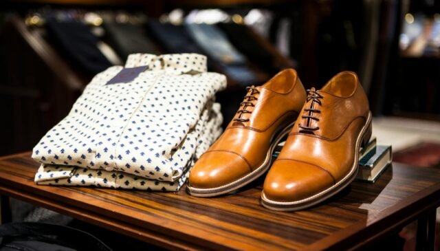 pair of brown leather casual shoes on table