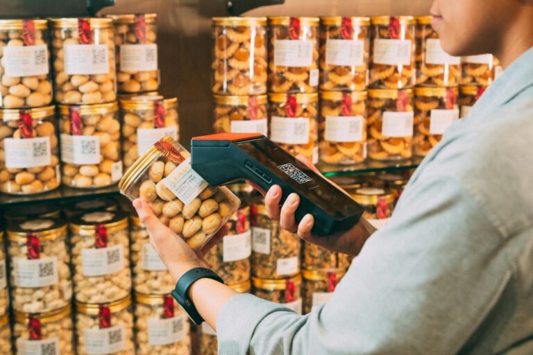 person scanning qr code on jar of pickles