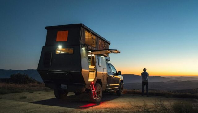 camper on desert at dusk