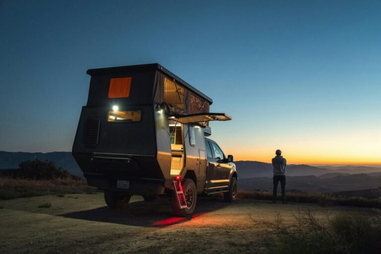 camper on desert at dusk