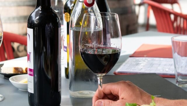 wine bottles beside wine glass