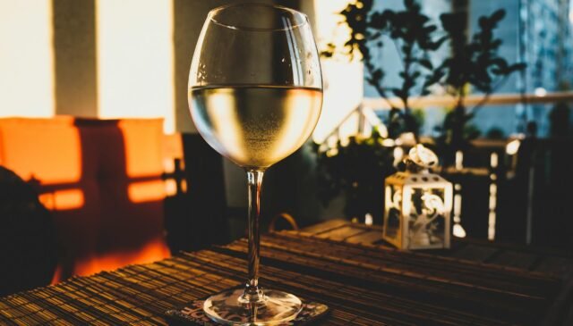 photo of glass of wine on the table