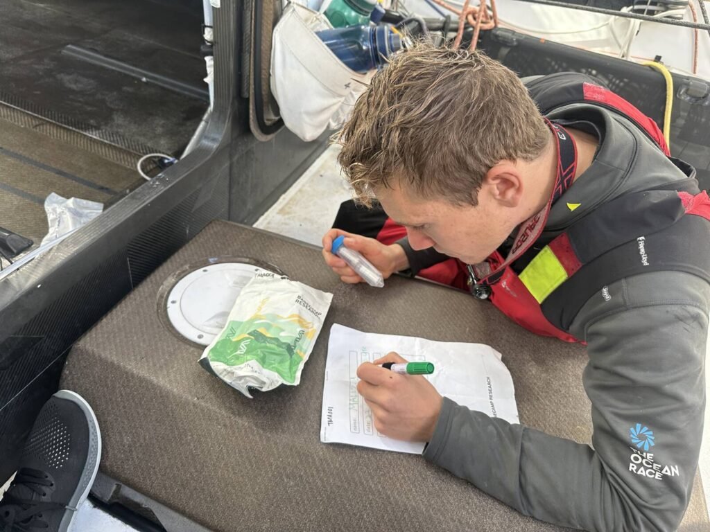 The Ocean Race 2022-23 - 24 March 2023, Leg 3, Day 25 onboard Team Malizia. Will Harris picks up water sample from this remote part of the Ocean between Point Nemo and Cape Horn.