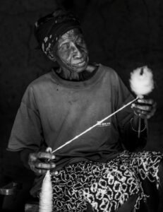 man holding thread spool