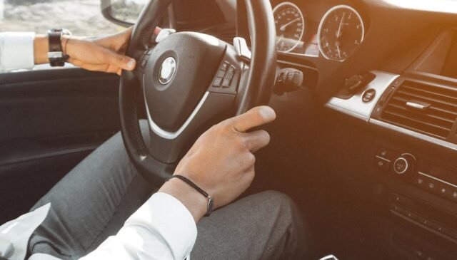 person drives a luxurious car
