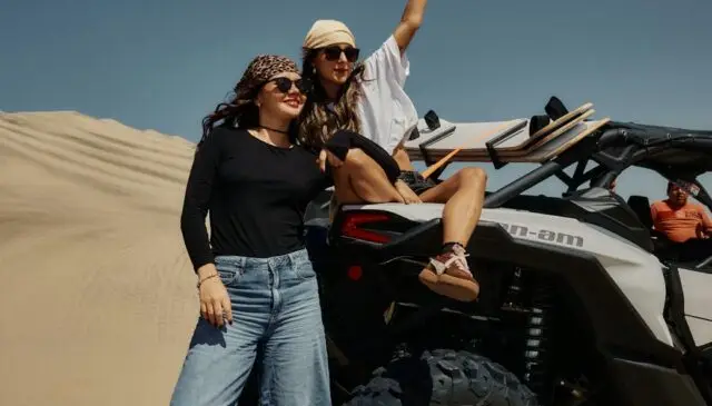 two friends enjoying an atv adventure in the desert