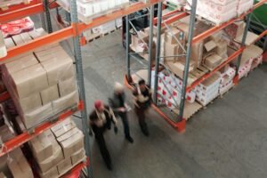 men walking in a warehouse