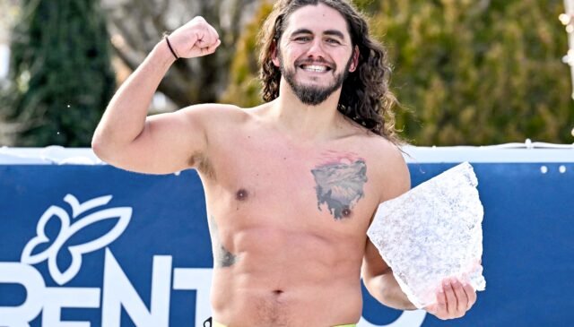 Athlete with a piece of ice after competing in the 50m Butterfly Men Heats during the IISA 6th World Ice Swimming Championships in Molveno, Italy, January 16, 2025.
