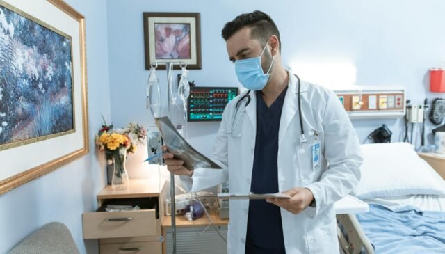 doctor checking a x ray film