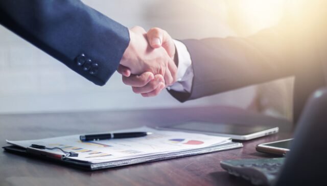 two men making a handshake