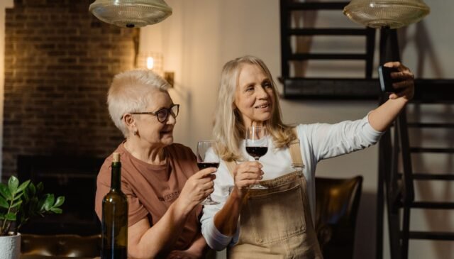 women holding wine glasses