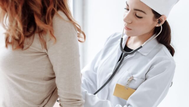 photo of doctor checking on her patient